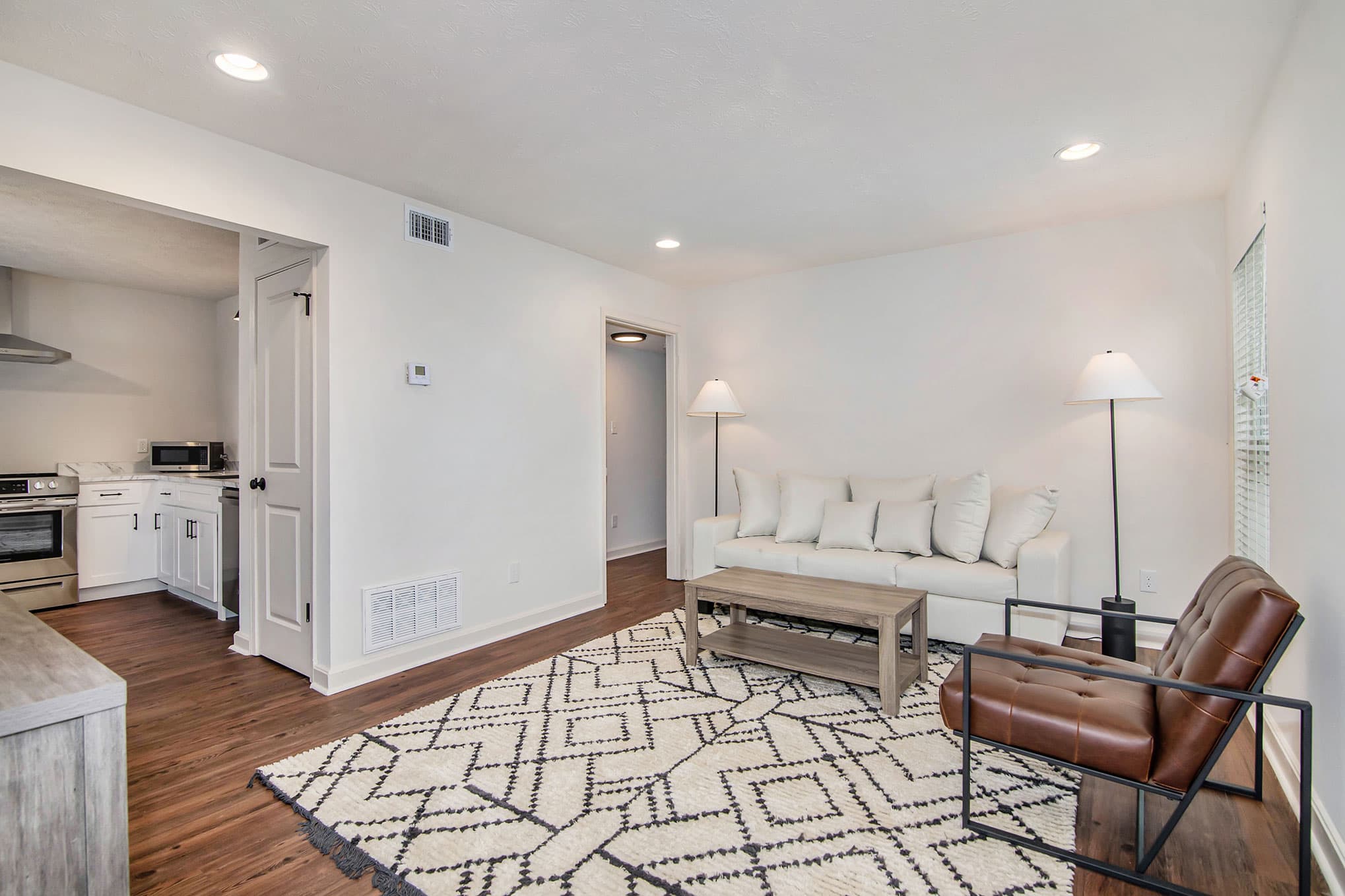 Modern living room with hardwood floors and contemporary furniture